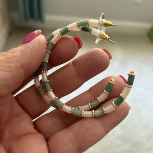 Super pretty, lightweight large hoop earrings. Great with a summer white dress!